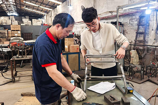 Designer and engineer discussing product development at DRS Furnitures